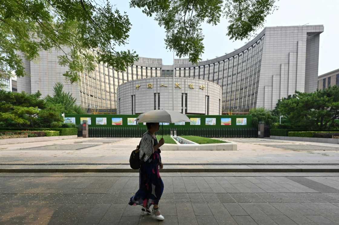 The People's Bank of China cut two benchmark interest rates in a bid to boost sluggish economic growth The People's Bank of China cut two benchmark interest rates in a bid to boost sluggish economic growth