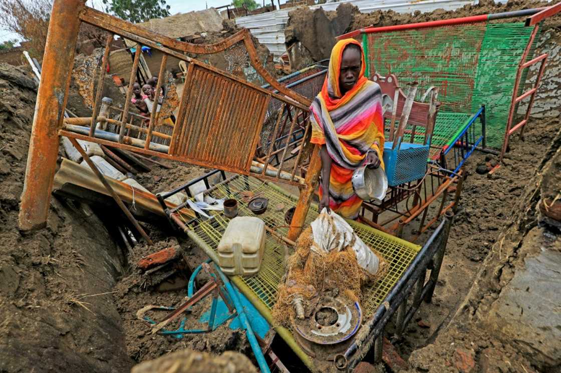 Blue Nile is awash with guns and is still struggling to rebuild after decades of civil war, with over 300 people killed in recent months: this photograph from August shows the aftermath of an attack