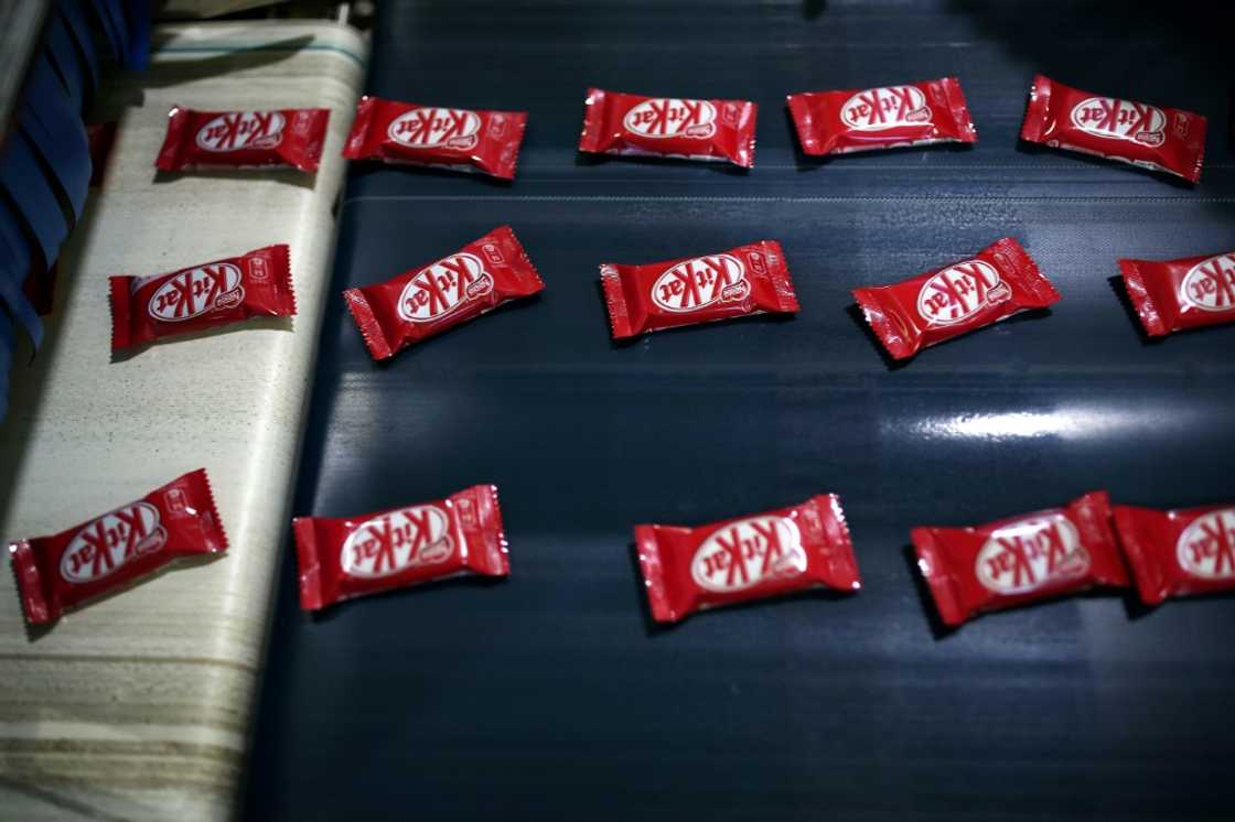 Inflation cut profit margins of Nestle, which makes KitKats and many other food products Inflation cut profit margins of Nestle, which makes KitKats and many other food products