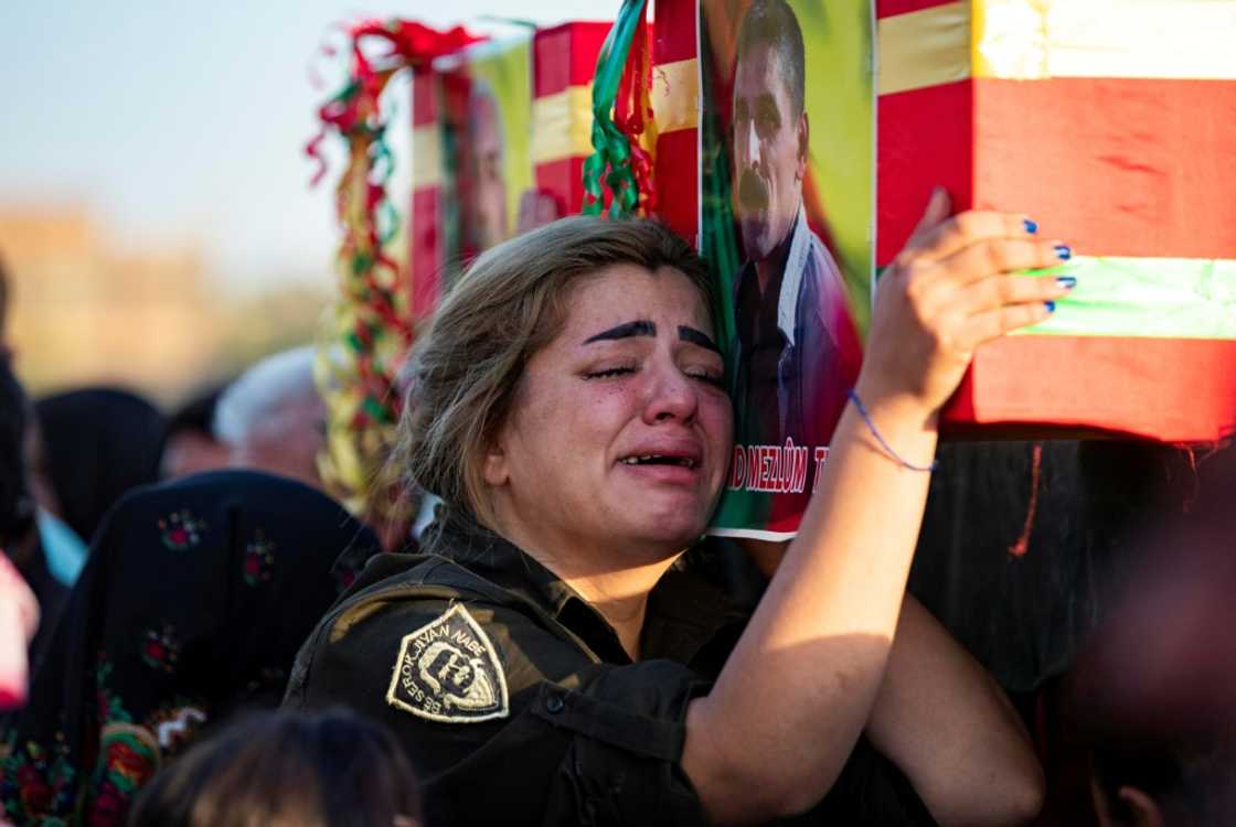 A mourner in the funeral procession of two civilians, sympathisers of the Syrian Democratic Forces (SDF), killed in a Turkish drone attack in Syria's northeastern Kurdish-majority city of Qamishli, on October 29, 2022 A mourner in the funeral procession of two civilians, sympathisers of the Syrian Democratic Forces (SDF), killed in a Turkish drone attack in Syria's northeastern Kurdish-majority city of Qamishli, on October 29, 2022