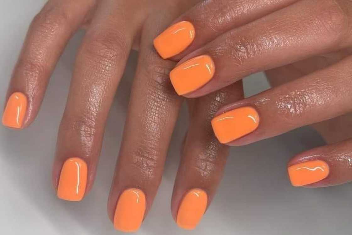 Short orange nails Short orange nails