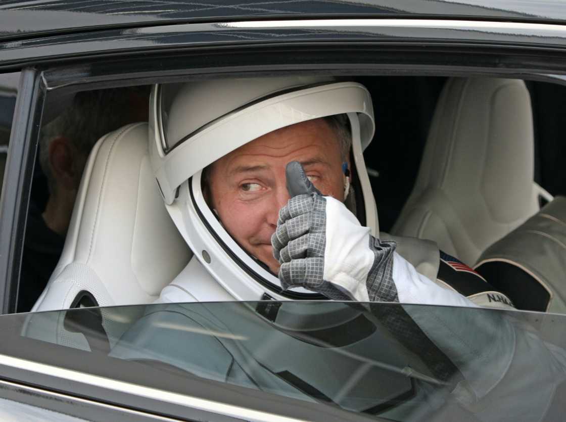 NASA Flight Commander Nick Hague greets family members before heading to the launch pad at the Kennedy Space Center in Florida