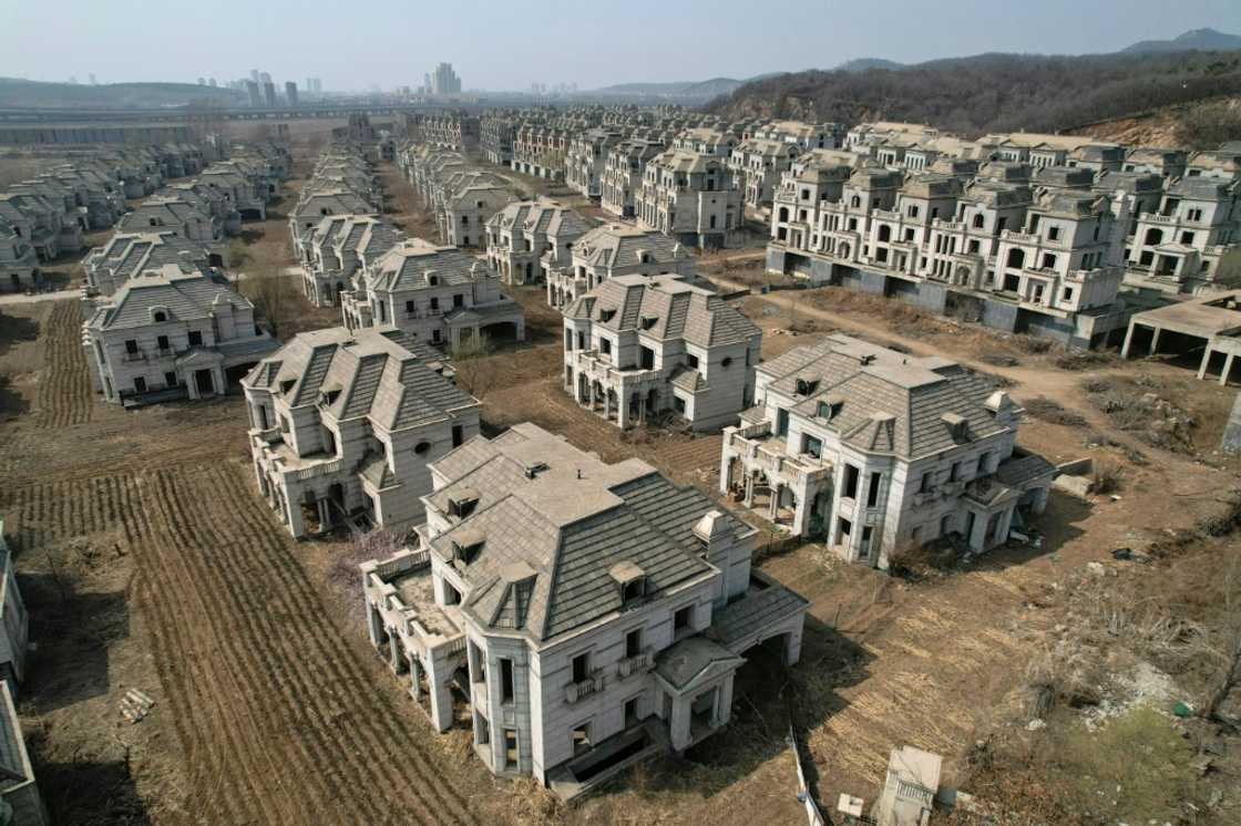 A luxury complex in Shenyang whose crumbling verandas and overgrown arches are stark symbols of a housing market in China crippled by its own excess