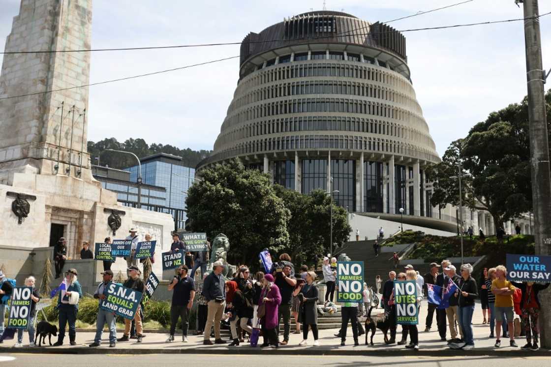 Protestors against the government's plans to tax emissions from farm animals gather outside New Zealand's parliament in Wellington on Thursday Protestors against the government's plans to tax emissions from farm animals gather outside New Zealand's parliament in Wellington on Thursday