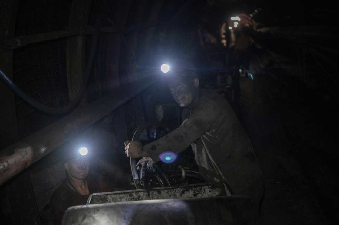 The heat is smothering in the shafts and the air is saturated with percolating dust The heat is smothering in the shafts and the air is saturated with percolating dust