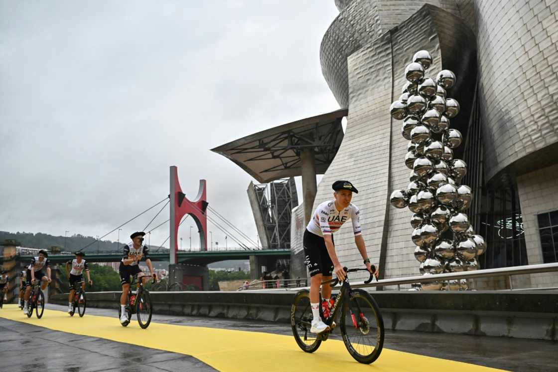 Tourist attraction: Tadej Pogacar, in a Basque beret, leads his UAE Team past Bilbao's Guggenheim Museum during the team introductions ahead of the 2023 Tour de France Tourist attraction: Tadej Pogacar, in a Basque beret, leads his UAE Team past Bilbao's Guggenheim Museum during the team introductions ahead of the 2023 Tour de France