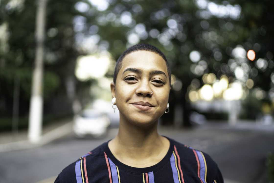 A young woman smiling looking at camera