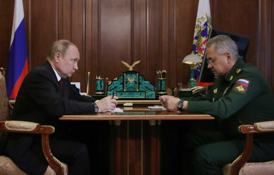 Russian President Vladimir Putin sits with Defence Minister Sergei Shoigu at the Kremlin Russian President Vladimir Putin sits with Defence Minister Sergei Shoigu at the Kremlin