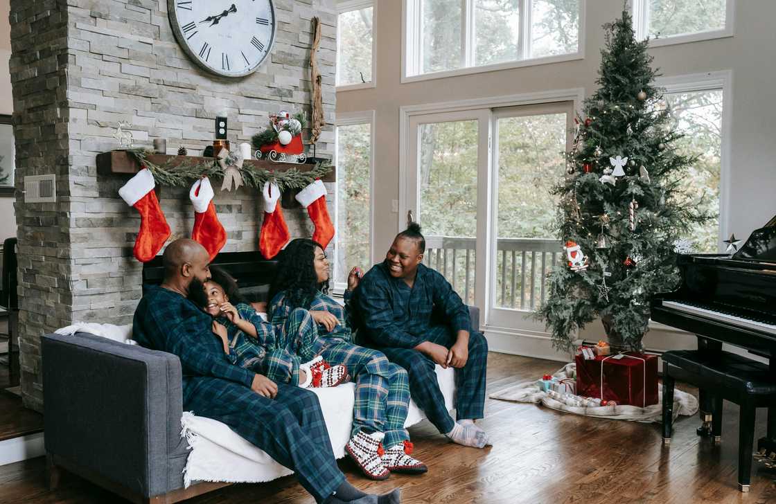 A family seated on the sofa during Christmas A family seated on the sofa during Christmas