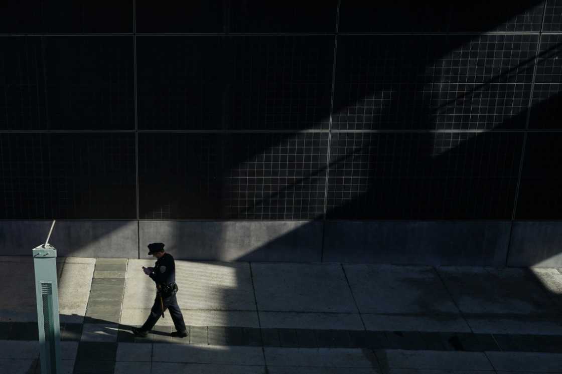 A police officer walks near APEC Summit headquarters in San Francisco as the city took pains to clean up ahead of the arrival of world leaders A police officer walks near APEC Summit headquarters in San Francisco as the city took pains to clean up ahead of the arrival of world leaders