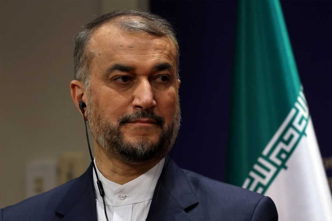 Iranian Foreign Minister Hossein Amir-Abdollahian shows off the tie-less look that remains de rigeur for government officials and other state employees Iranian Foreign Minister Hossein Amir-Abdollahian shows off the tie-less look that remains de rigeur for government officials and other state employees