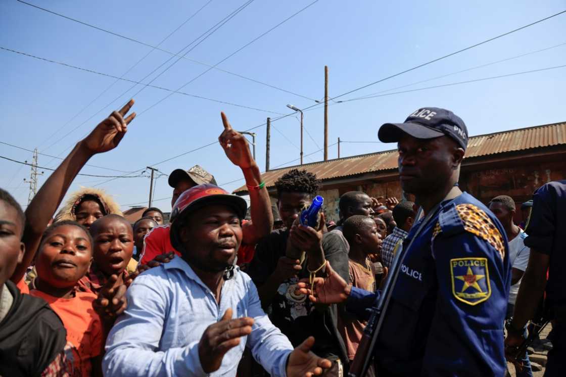 Anti-Rwanda protestors gathered near the border post after the shooting incident Anti-Rwanda protestors gathered near the border post after the shooting incident