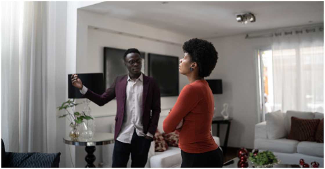 A man shows off his home to a potential renter