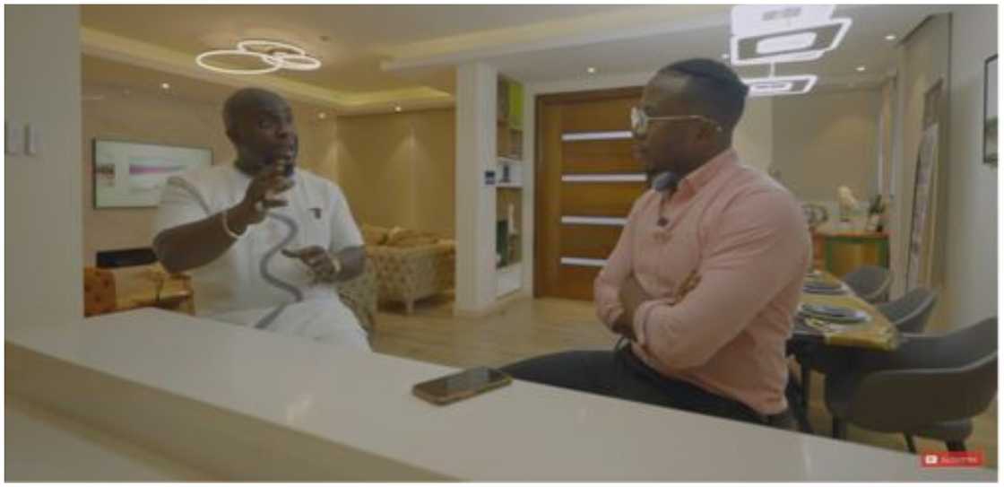 Mr Oku (left) explains the idea behind his residential development to the interviewer Mr Oku (left) explains the idea behind his residential development to the interviewer