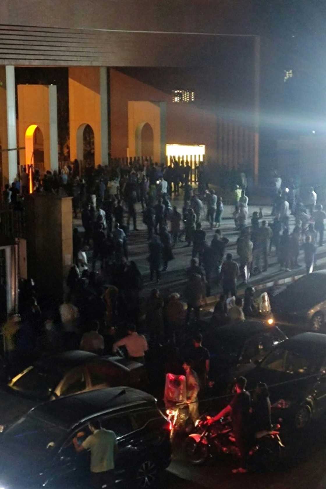 Crowds gather outside Tehran's Sharif University of Technology where clashes erupted overnight, in an image from a video clip made available on October 2, 2022 Crowds gather outside Tehran's Sharif University of Technology where clashes erupted overnight, in an image from a video clip made available on October 2, 2022
