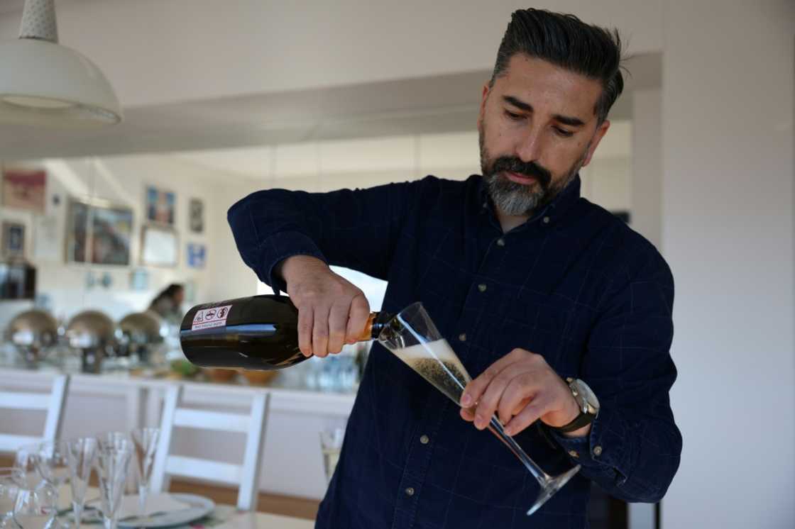 Ahmet Ay, of the Vinkara winery, pours a glass of sparkling wine Ahmet Ay, of the Vinkara winery, pours a glass of sparkling wine