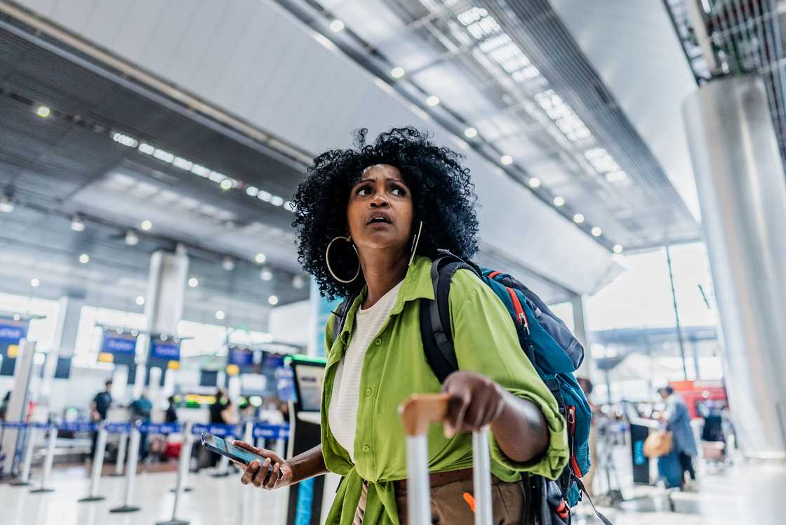Worried mid adult woman on a airport