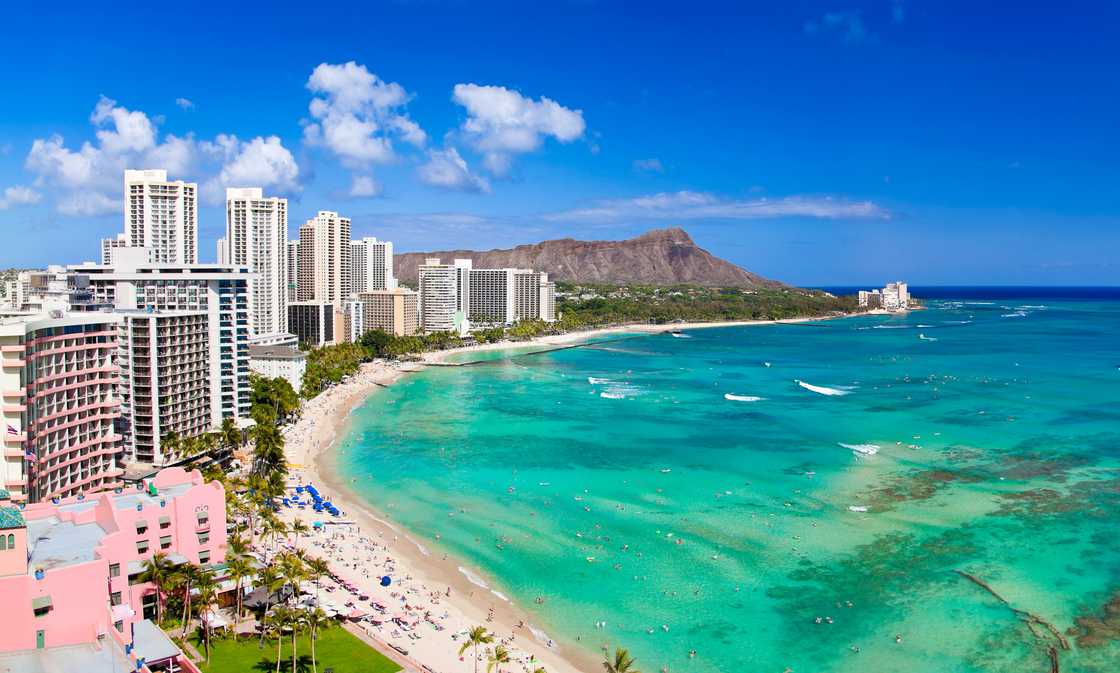 Honolulu, Hawaii resorts Waikiki beach in the afternoon sun.