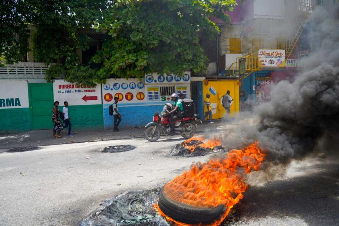 Haitians protesting in Port-au-Prince in July 2022 -- soaring prices, food and fuel shortages and rampant gang violence are accelerating a brutal downward spiral for security in the capital Haitians protesting in Port-au-Prince in July 2022 -- soaring prices, food and fuel shortages and rampant gang violence are accelerating a brutal downward spiral for security in the capital