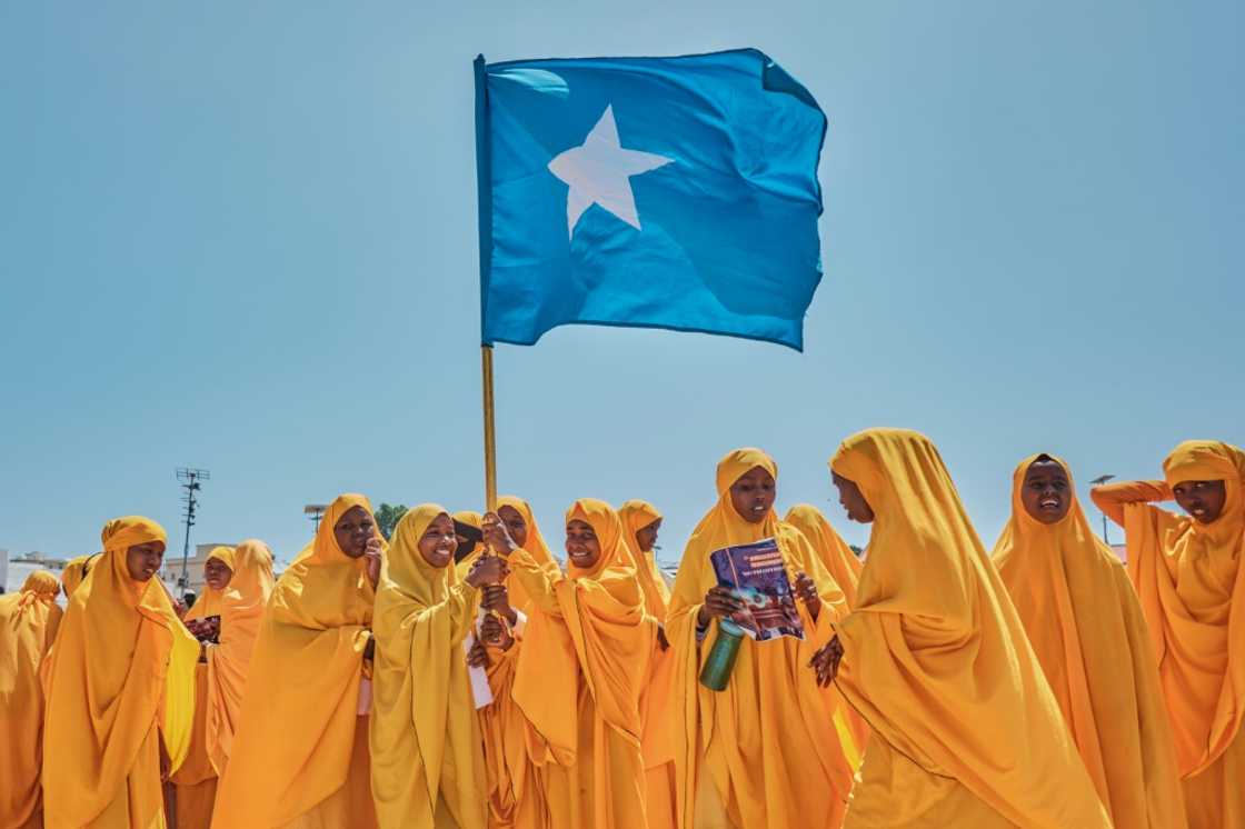 Students wave a Somali flag during a demonstration in support of the government over the controversial deal between Ethiopia and the breakaway region of Somaliland Students wave a Somali flag during a demonstration in support of the government over the controversial deal between Ethiopia and the breakaway region of Somaliland
