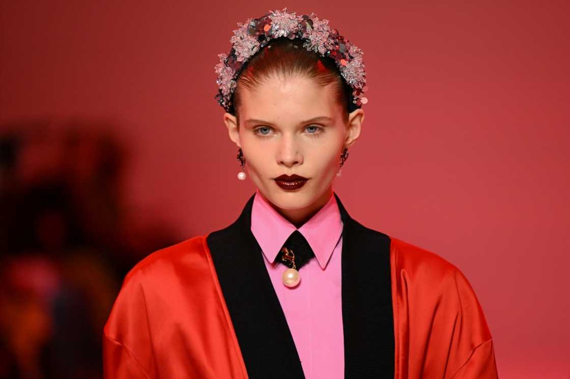 A model sporting a Ferrari creation in black and red A model sporting a Ferrari creation in black and red