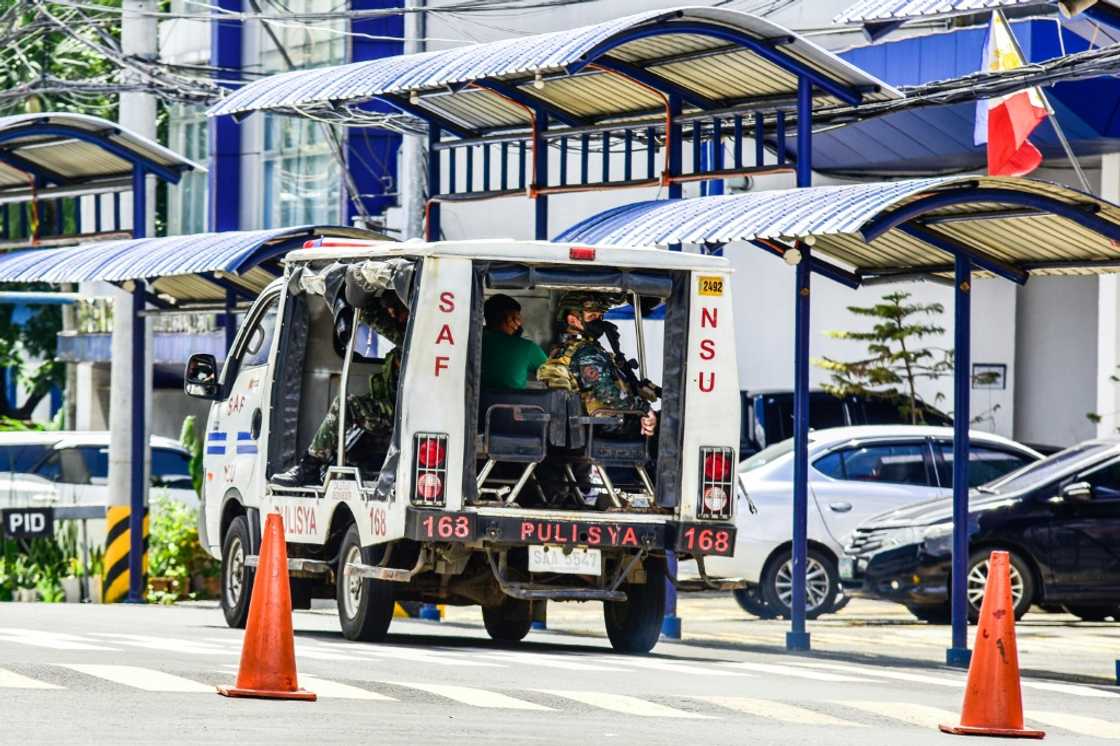 Police chief General Rodolfo Azurin said the three inmates were members of the militant group Abu Sayyaf, which has been accused of kidnapping and beheading several foreigners Police chief General Rodolfo Azurin said the three inmates were members of the militant group Abu Sayyaf, which has been accused of kidnapping and beheading several foreigners