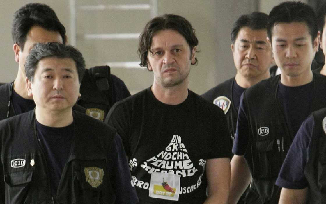Rifat Hadziahmetovic, an alleged member of the Pink Panther gang with law enforcement Rifat Hadziahmetovic, an alleged member of the Pink Panther gang with law enforcement
