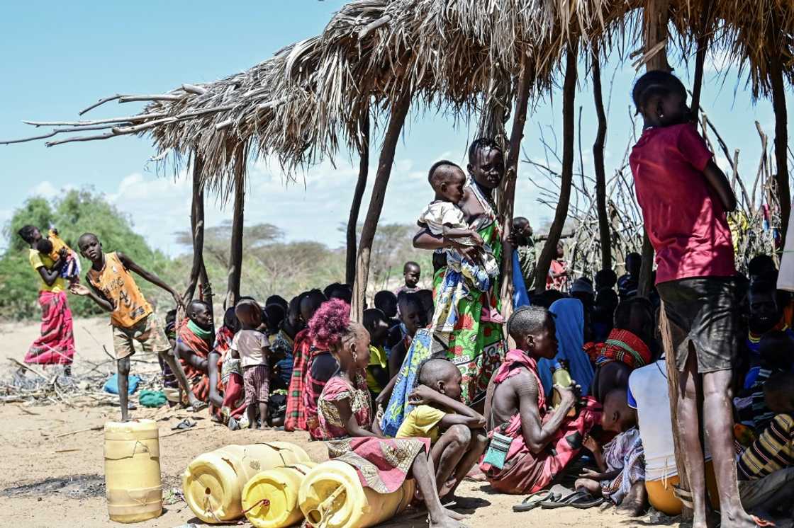 Women from Kenya's pastoral Turkana community wait on October 18, 2022 at a drought intervention community outreach clinic organised by UNICEF Women from Kenya's pastoral Turkana community wait on October 18, 2022 at a drought intervention community outreach clinic organised by UNICEF