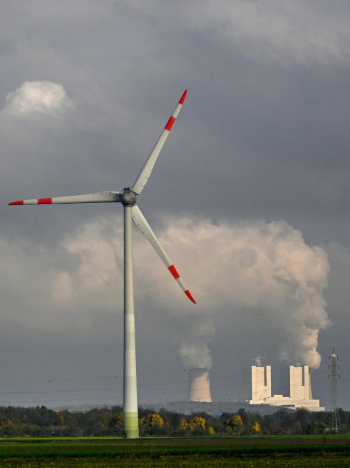 A wind turbine and a lignite-fired power plant near Neurath, western Germany A wind turbine and a lignite-fired power plant near Neurath, western Germany