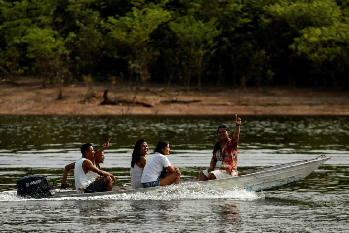 A boat ferries indigenous Kambeba people to vote in the Brazilian Amazon