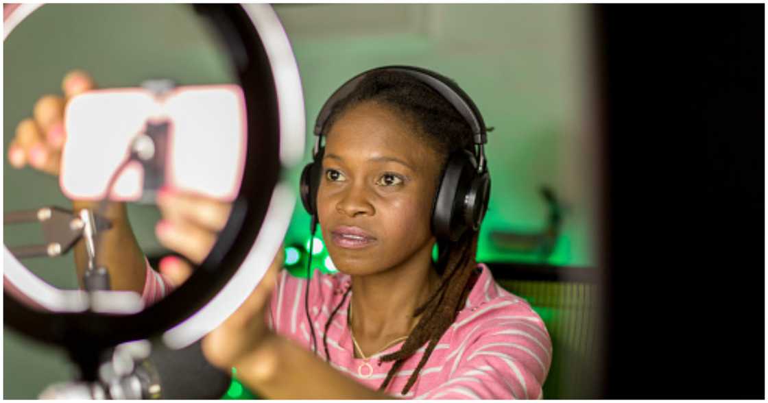 A lady uses social media to promote her work A lady uses social media to promote her work