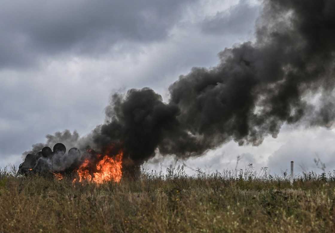 A destroyed Russian armoured personnel carrier burns on the outskirts of Izyum A destroyed Russian armoured personnel carrier burns on the outskirts of Izyum