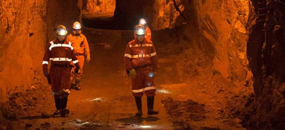 A group of people walking underground