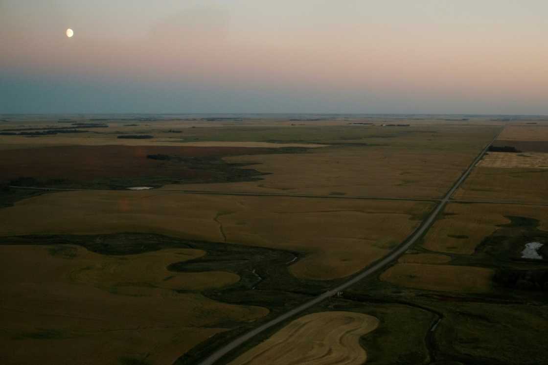 Dusk falls over the Indigenous community of James Smith Cree Nation during a manhunt for Myles Sanderson, a suspect in the mass stabbings that occurred in the Canadian community Dusk falls over the Indigenous community of James Smith Cree Nation during a manhunt for Myles Sanderson, a suspect in the mass stabbings that occurred in the Canadian community
