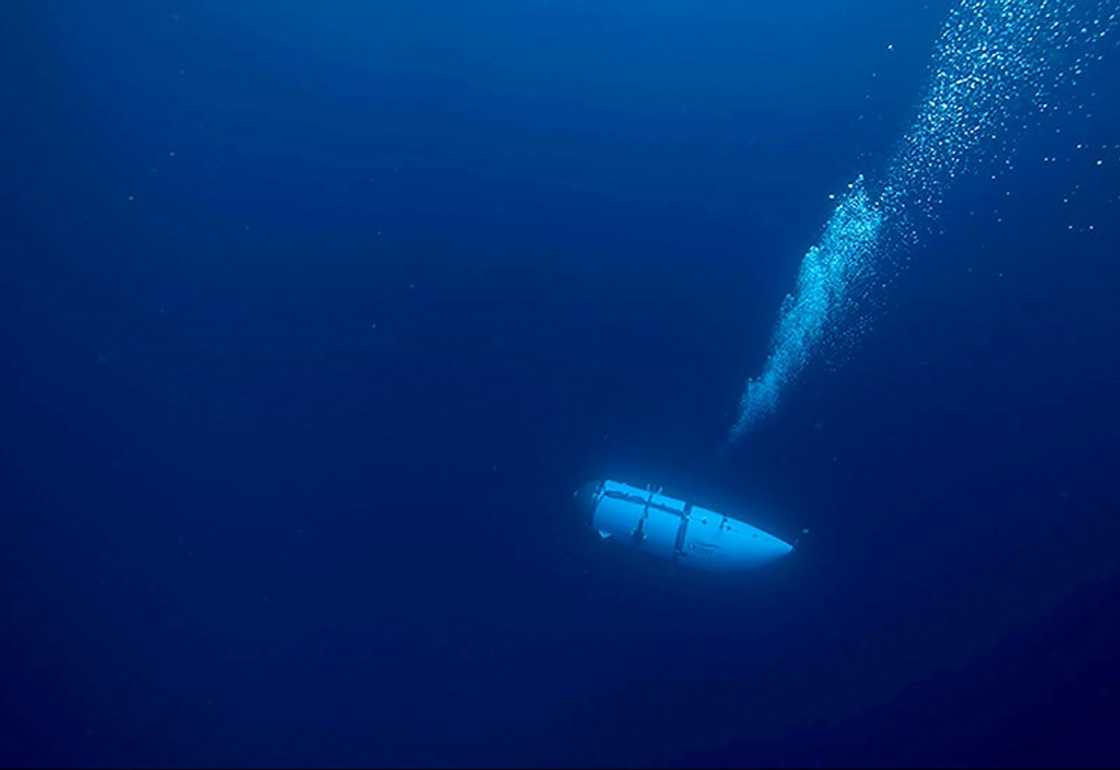 OceanGate, which operated the Titan sub (pictured here during an undated descent) before it imploded last month, said it is suspending all expeditions