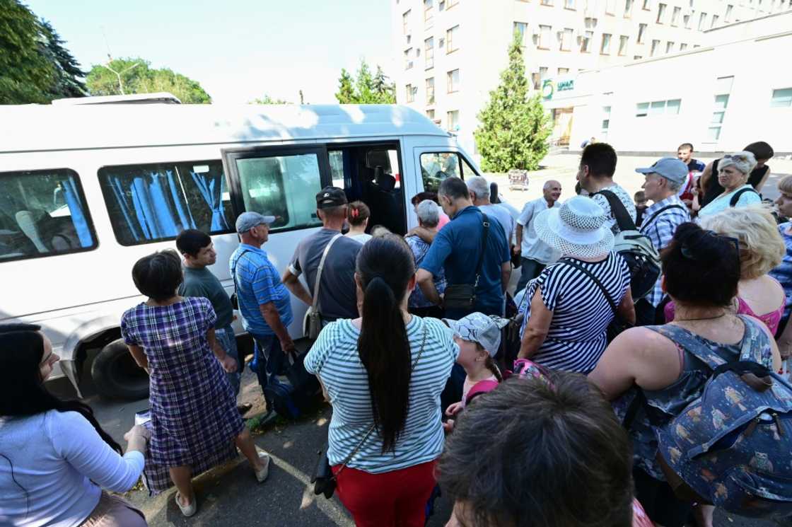Residents of the city of Sloviansk and neighbouring towns wait for buses to evacuate them to the city of Dnipro, on Wednesday Residents of the city of Sloviansk and neighbouring towns wait for buses to evacuate them to the city of Dnipro, on Wednesday