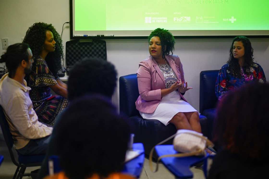 Rio de Janeiro state congresswoman and re-election candidate Renata Souza (C), of the Socialism and Freedom Party (PSOL), takes part in a meeting at the Favela Observatory Center of Mare favela, in Rio de Janeiro, Brazil, on September 02, 2022