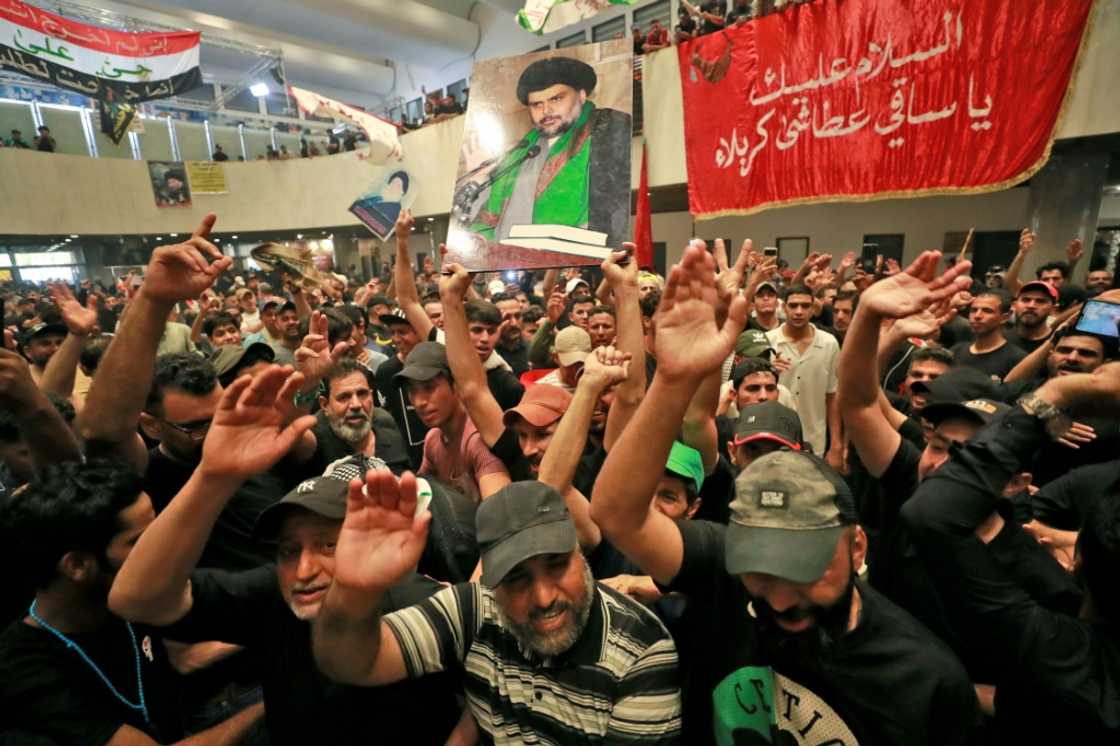 Supporters of Iraqi cleric Moqtada Sadr seen here in parliament on Monday Supporters of Iraqi cleric Moqtada Sadr seen here in parliament on Monday