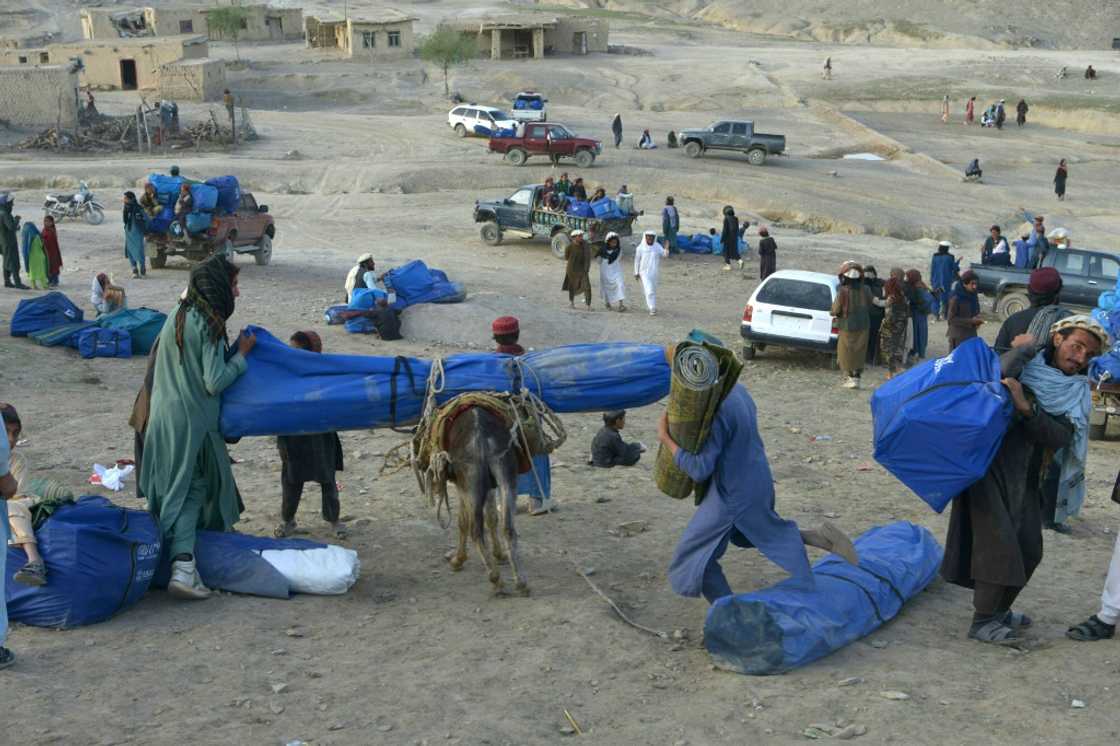 A donkey is loaded with a tent in Spera district, hard-hit by last qweek's 5.9-magnitude earthquake