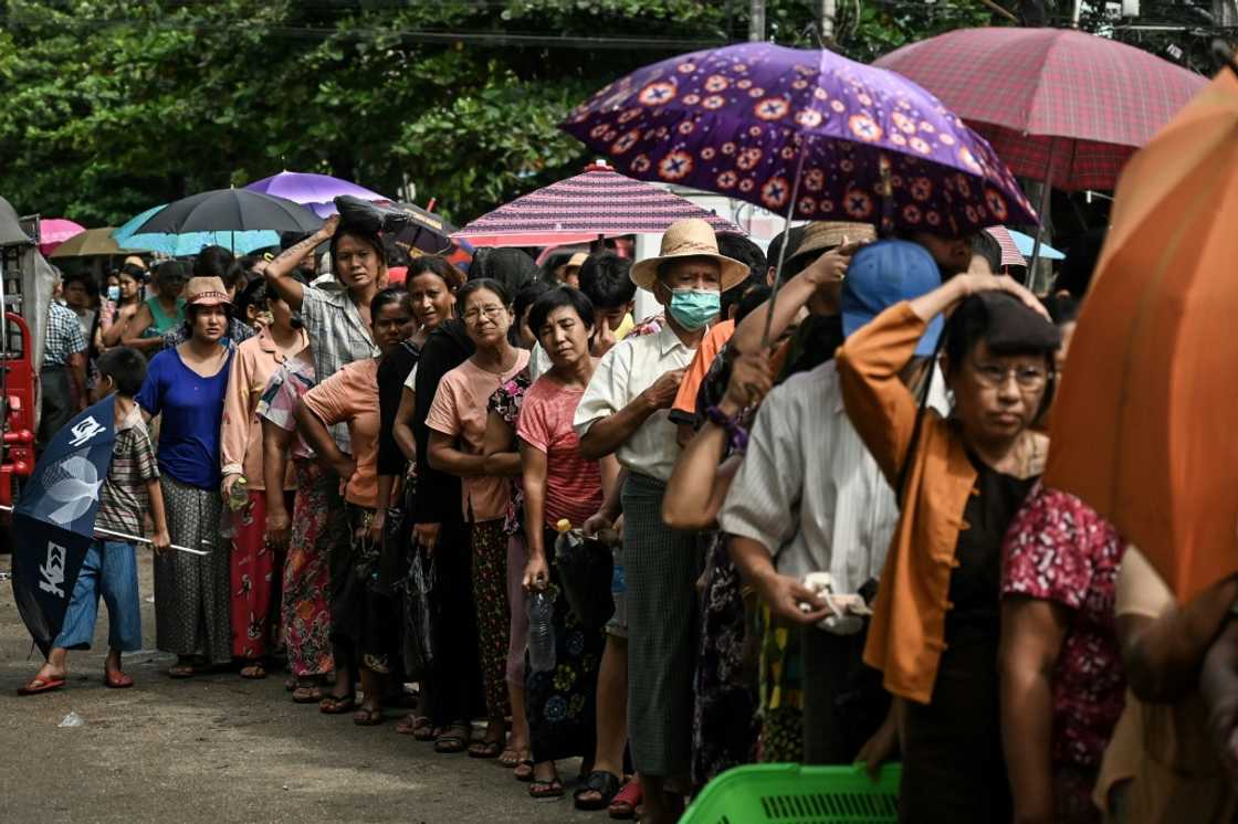 Queues for basic commodities have sprung up in Myanmar's commercial capital