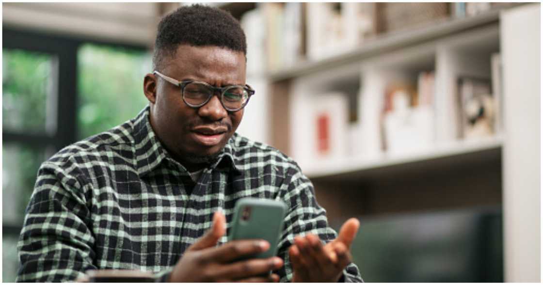 An agent is shocked at a text he received from a client. An agent is shocked at a text he received from a client.