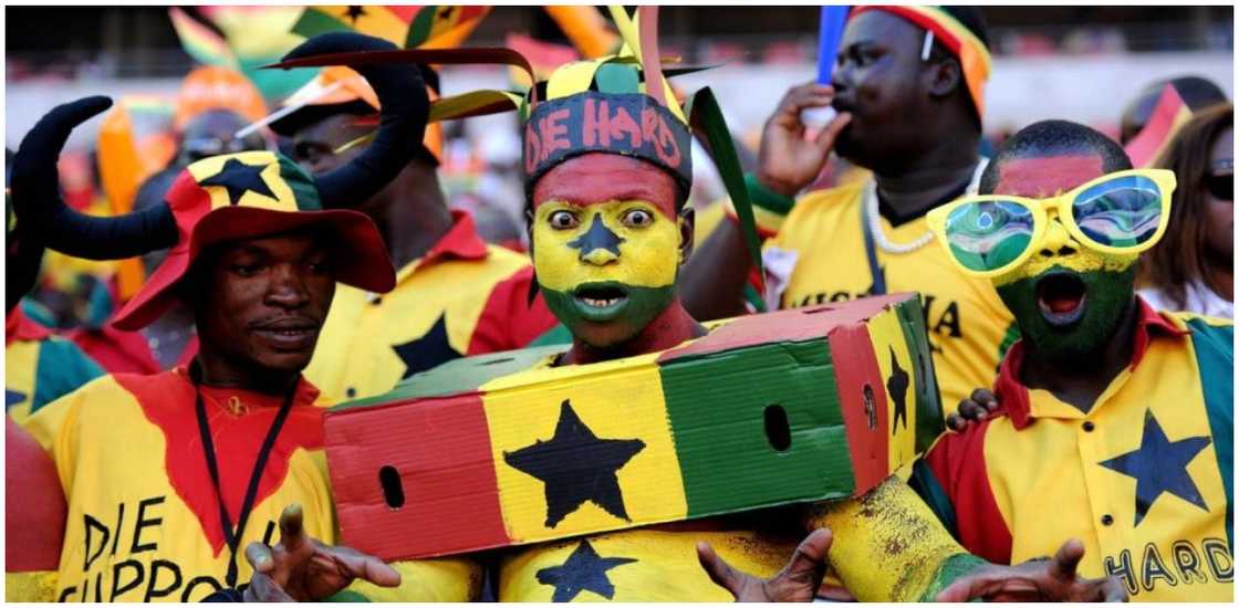 Enthusiastic Ghanaian football supporters cheer the Black Stars on Enthusiastic Ghanaian football supporters cheer the Black Stars on