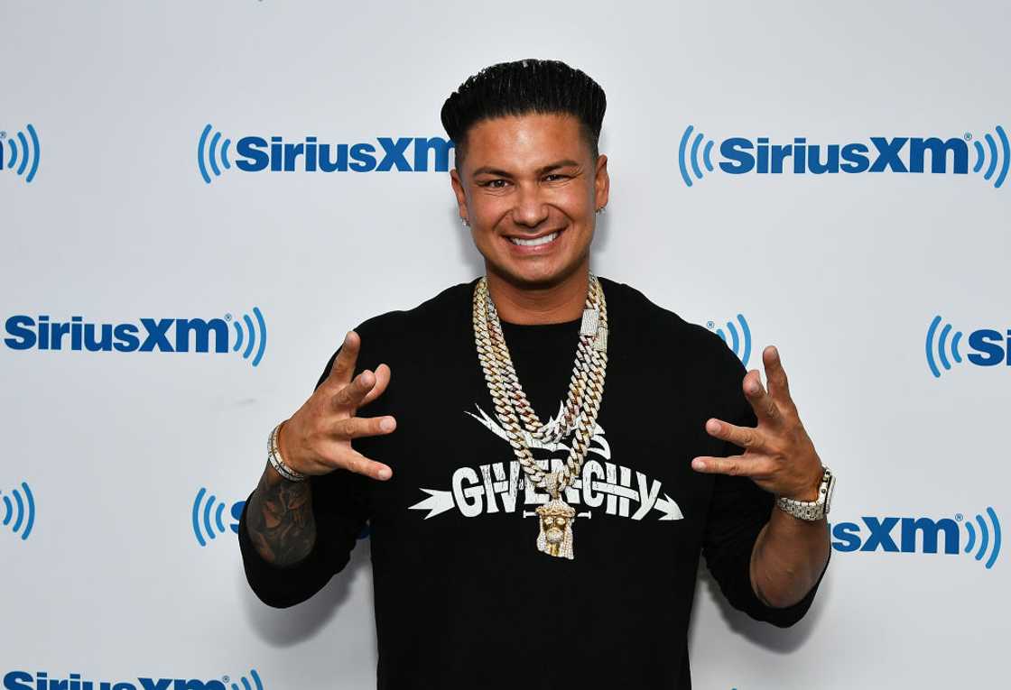 DJ Pauly D in a black shirt and bling