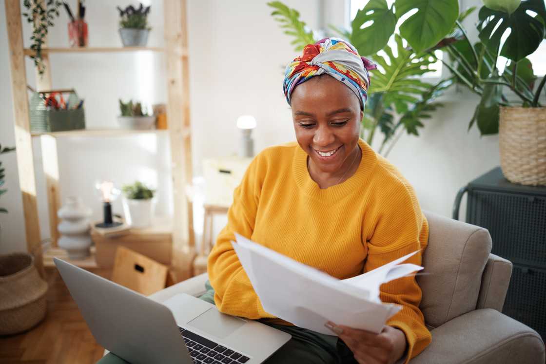 A young woman working from the comfort of her home. A young woman working from the comfort of her home.
