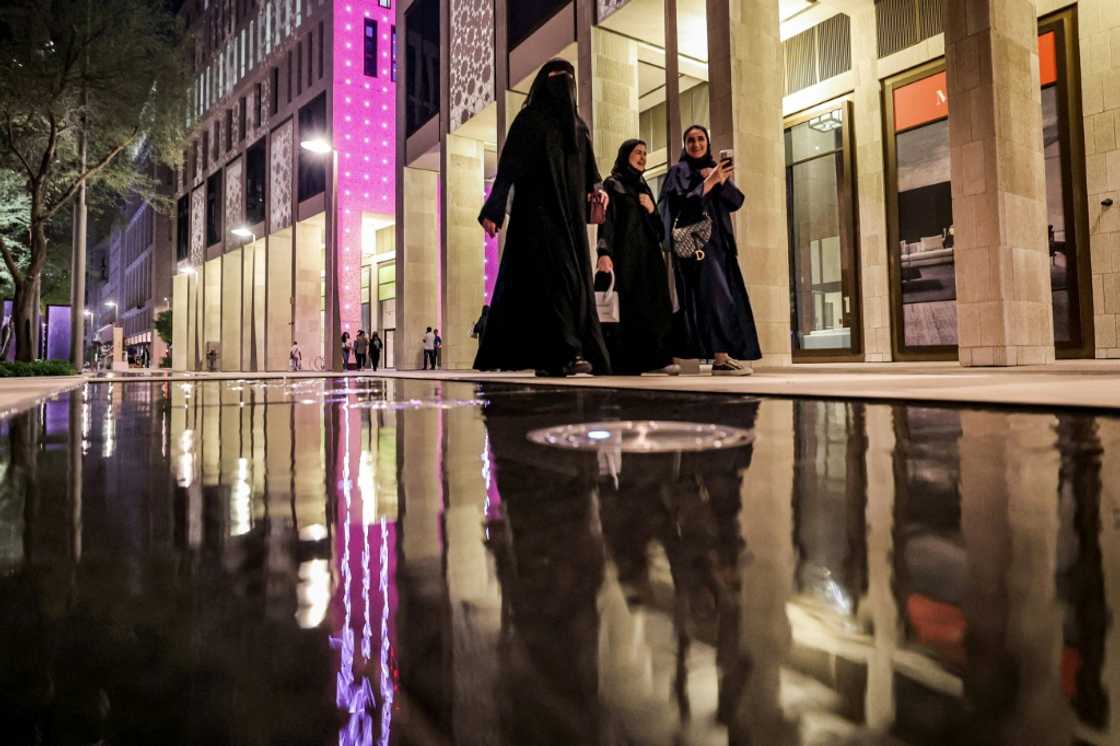 While the Muslim veil is not compulsory in Qatar, women must dress 'modestly', covered from the shoulders to knees While the Muslim veil is not compulsory in Qatar, women must dress 'modestly', covered from the shoulders to knees