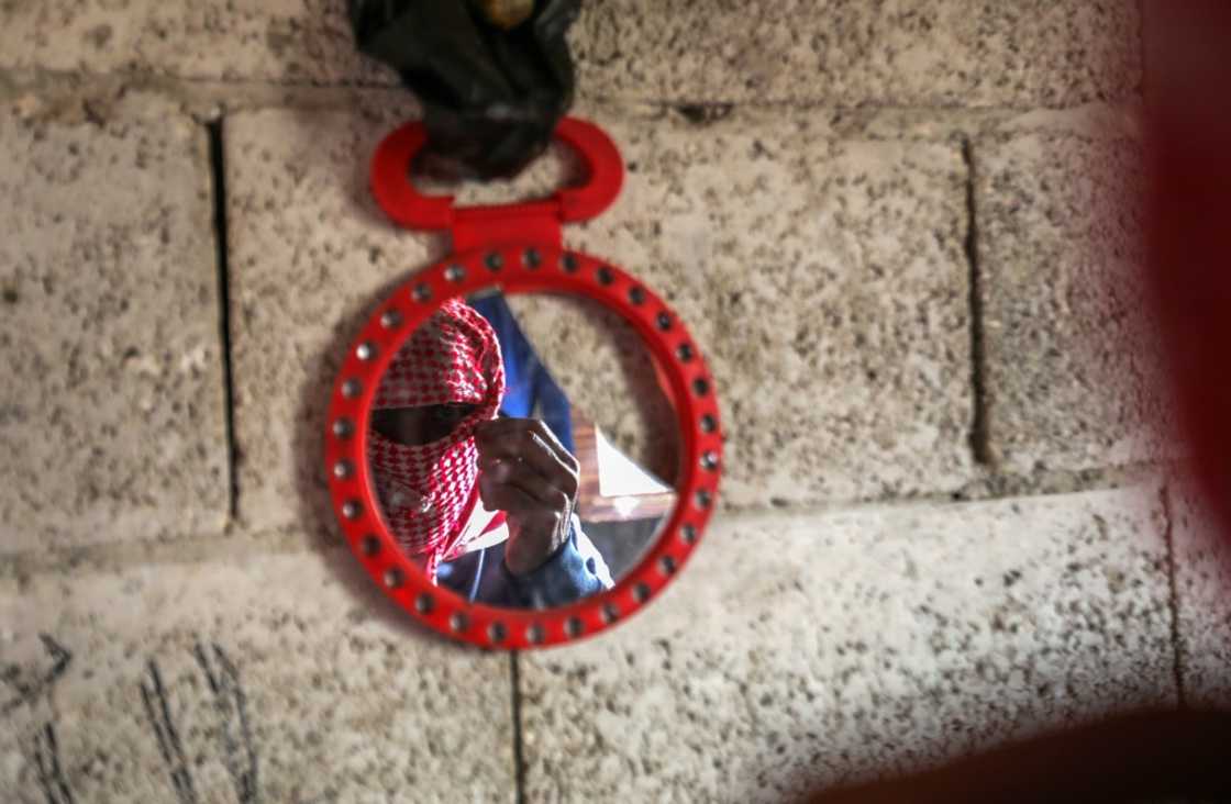 A captagon dealer masks his face with a traditional keffiyeh scarf before an AFP interview in Aleppo, Syria A captagon dealer masks his face with a traditional keffiyeh scarf before an AFP interview in Aleppo, Syria
