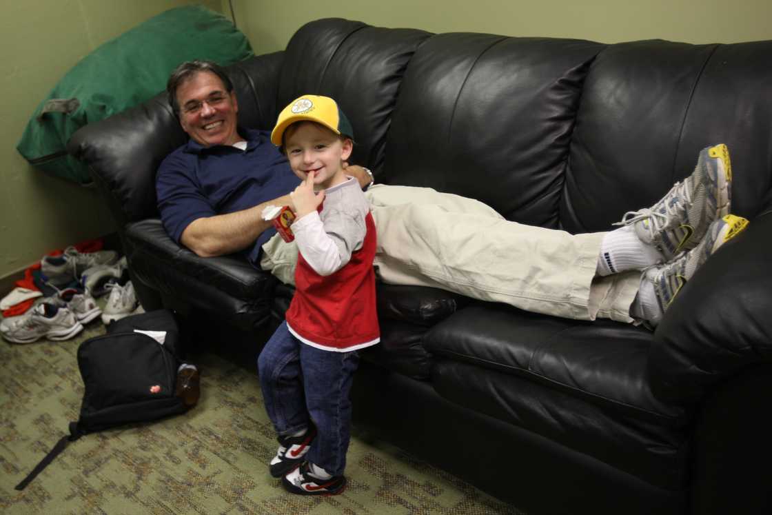 Billy Beane relaxing with his son in the clubhouse prior to the game against the Baltimore Orioles at the Oakland Coliseum in Oakland, California Billy Beane relaxing with his son in the clubhouse prior to the game against the Baltimore Orioles at the Oakland Coliseum in Oakland, California