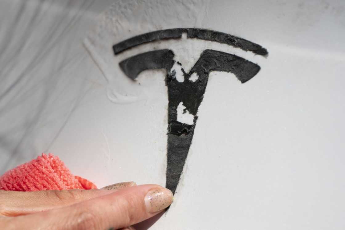 Tesla's image has been badly tarnished by Elon Musk's role in the US government's cost-cutting drive and his company has become the target of vandals Tesla's image has been badly tarnished by Elon Musk's role in the US government's cost-cutting drive and his company has become the target of vandals