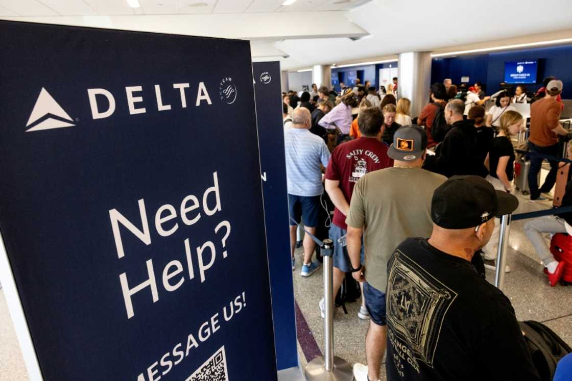 Travelers wait in line at the airport in Los Angeles, California on July 19, 2024 following a global IT crash that hobbled airlines, banks, broadcasters and other businesses Travelers wait in line at the airport in Los Angeles, California on July 19, 2024 following a global IT crash that hobbled airlines, banks, broadcasters and other businesses