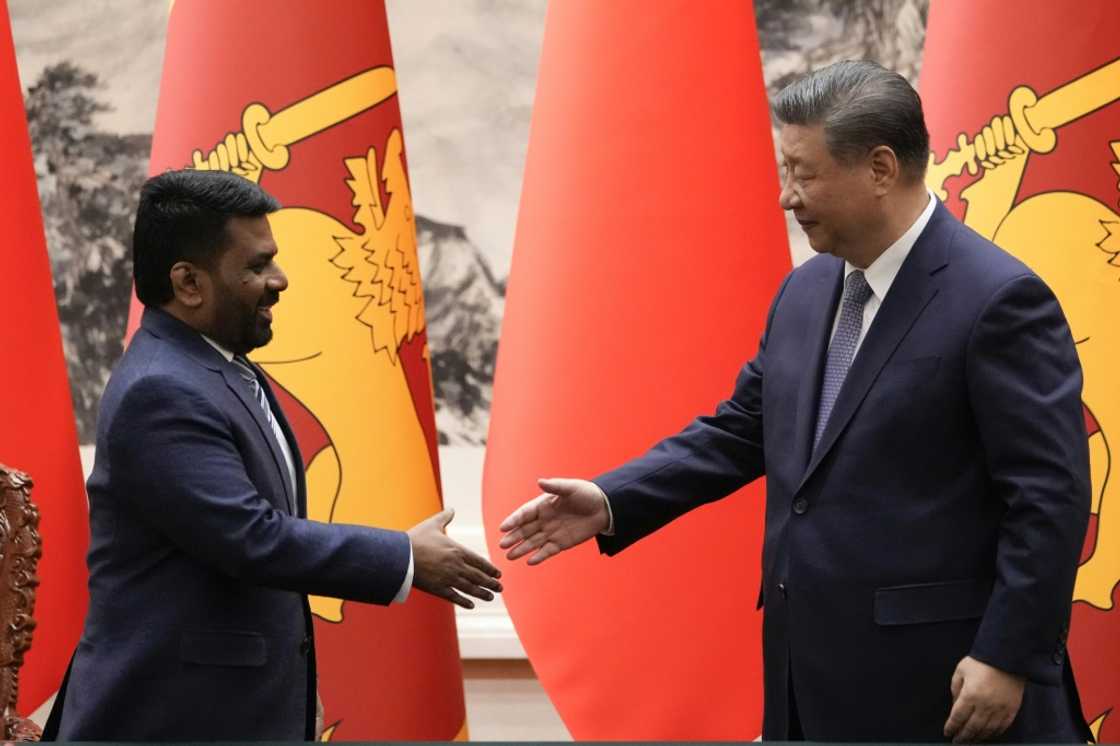 Chinese President Xi Jinping (R) shakes hands with Sri Lankan President Anura Kumara Dissanayake during a signing ceremony at the Great Hall of the People in Beijing on January 15, 2025 Chinese President Xi Jinping (R) shakes hands with Sri Lankan President Anura Kumara Dissanayake during a signing ceremony at the Great Hall of the People in Beijing on January 15, 2025